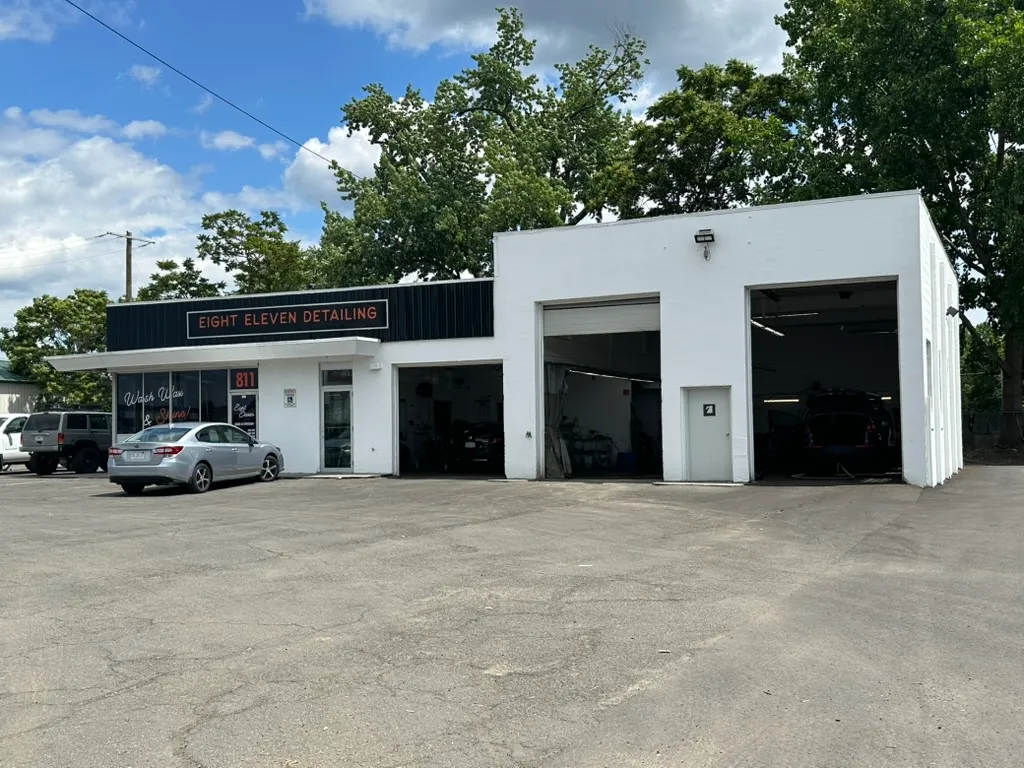 Where the actual hand-detailing work happens — the wash bays vehicles come through for every Wash & Wax, Interior Detail, and Full Detail package.