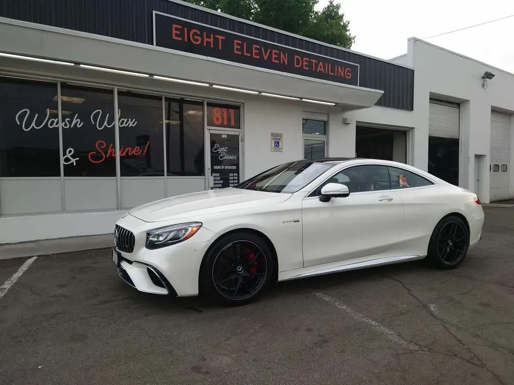 A Mercedes-AMG S-Class Coupe outside our storefront after a Full Detail — hand wash, machine polish, and paint sealant.